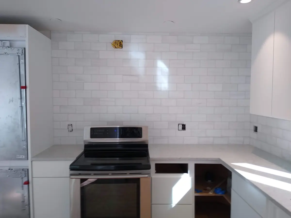 White Marble Subway Tile — Classic 3x6 white marble subway tile backsplash with clean grout lines